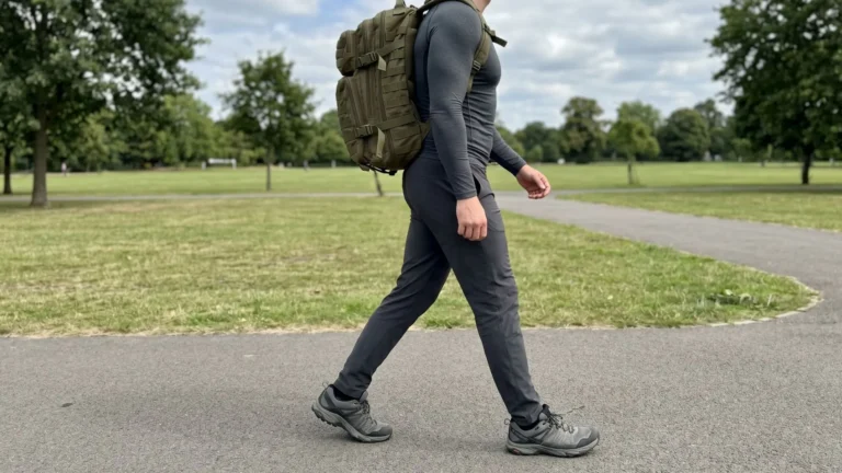 Side profile of man rucking with slight "Ruck March Lean" showing proper ruck march posture technique.